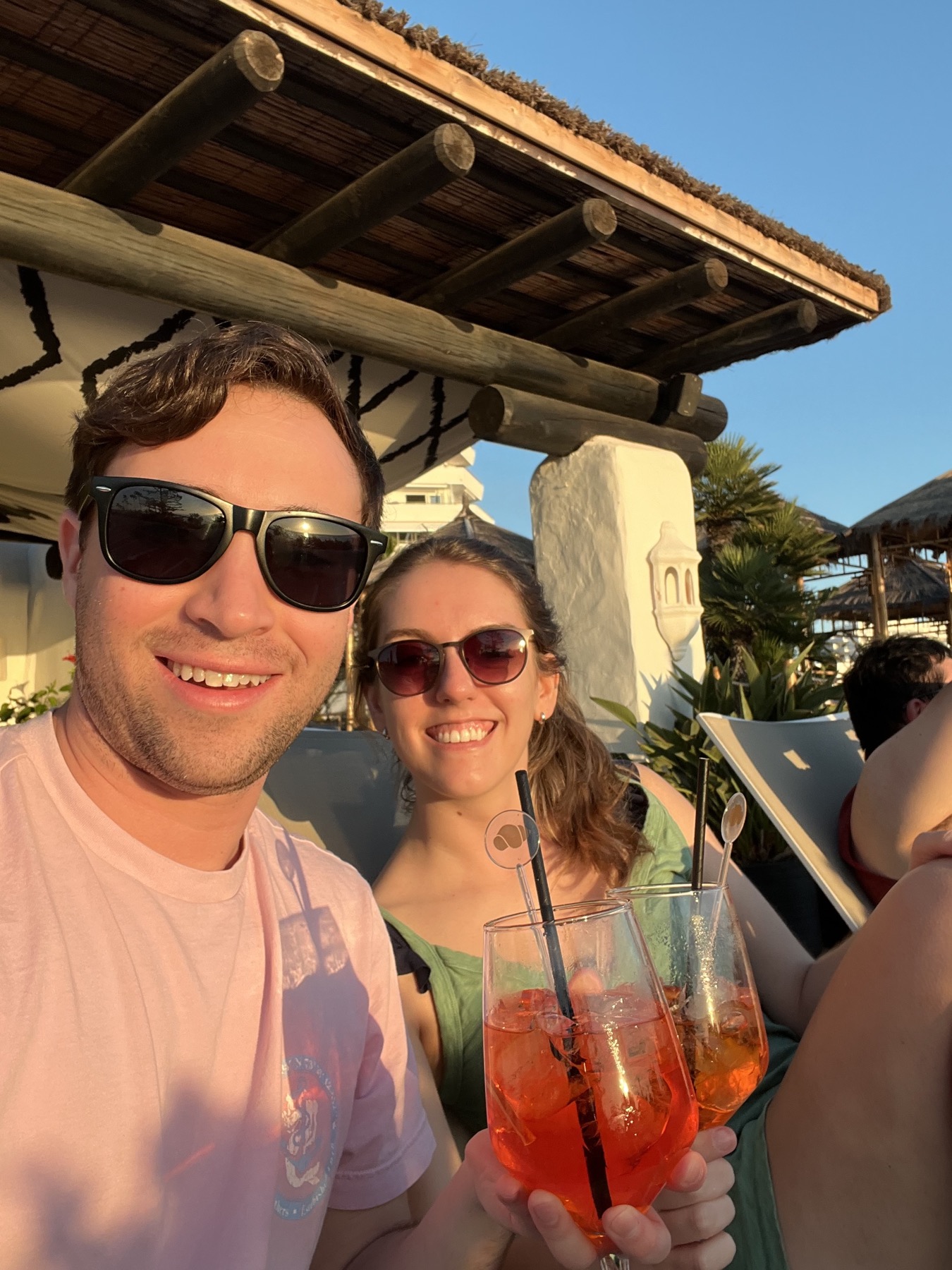 Caitlin and Paul toasting at golden hour